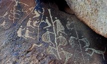 The ancient Aboriginal rock carving known as 'Climbing Man' (centre) is shown in this photo taken on the Burrup Peninsula in Australia in 2008.