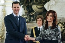 Syrian President Bashar al-Assad (left) shakes hands with Argentinean President Cristina Kirchner at a meeting in Buenos Aires.