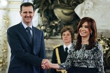 Syrian President Bashar al-Assad (left) shakes hands with Argentinean President Cristina Kirchner at a meeting in Buenos Aires. Syrian President Bashar al-Assad (left) shakes hands with Argentinean President Cristina Kirchner at a meeting in Buenos Aires.
