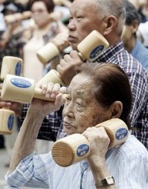 This 2008 file photo shows elderly people exercising with wooden dumb-bells in Tokyo, to celebrate Japan's Respect for the Aged Day. This 2008 file photo shows elderly people exercising with wooden dumb-bells in Tokyo, to celebrate Japan's Respect for the Aged Day.