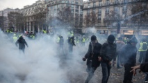 Tear gas fired, hundred arrested at 'Yellow Vest' protests in Paris
