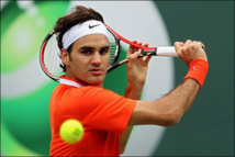 Federer battles past qualifier Evans to reach Open third round
