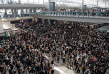 Protesters, passengers flee Hong Kong airport after flights nixed Protesters, passengers flee Hong Kong airport after flights nixed