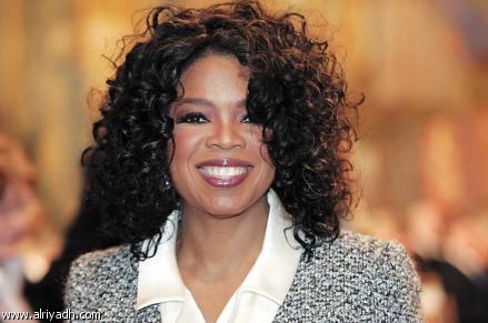Beaming Oprah celebrates with first grads of S Africa