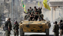 Syrian Kurds quit town on border with Turkey amid shaky truce