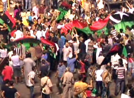 Libya marks revolution day as leader issues warning