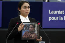 Daughter of jailed Uighur activist accepts EU prize in his name Daughter of jailed Uighur activist accepts EU prize in his name