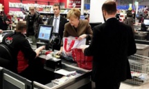 Amid crisis, Germany's Merkel goes shopping for toilet paper and wine