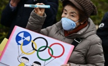 Delayed Tokyo Olympics should be held 'at any cost,' minister says