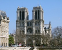 Topless women fete pope's resignation in Paris cathedral