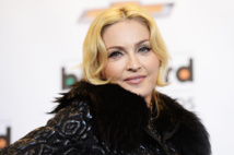 Madonna closes Coachella festival with wet-kiss surprise