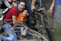 Barbed wire and stun grenades welcome refugees to Macedonia