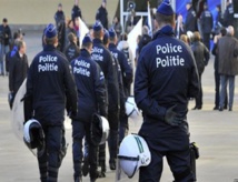Belgium weighs extending lockdown as police hunt Paris attackers
