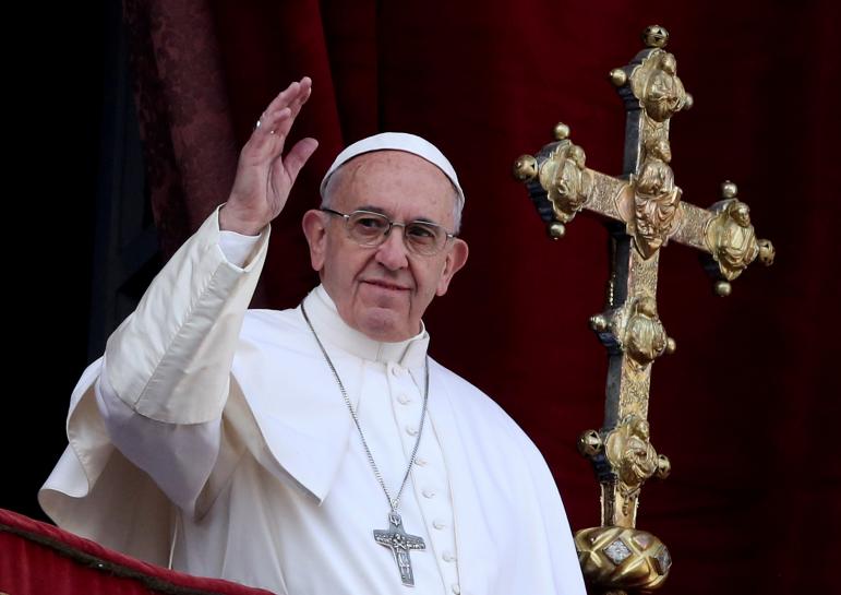 Pope Francis defends stance on Rohingya on return to Rome