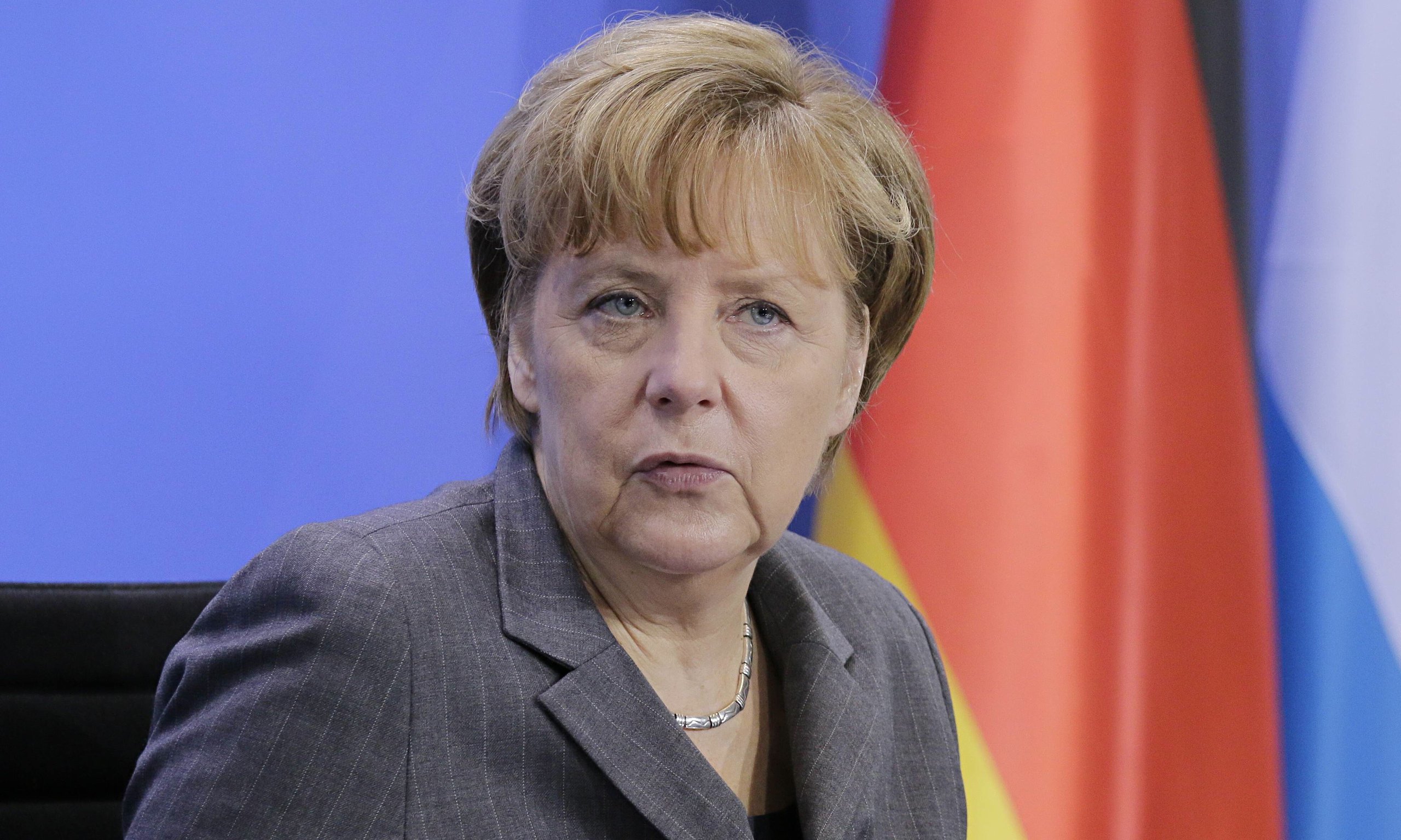 Merkel expects tough talks as coalition negotiations approach end
