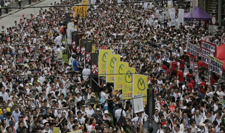 Thousands defy Beijing's warnings with latest Hong Kong protest march