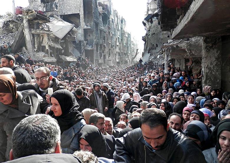 Syria's besieged Yarmuk gets UN aid after two-week halt