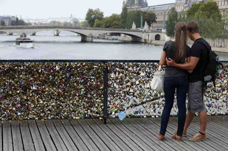 'Locks of love' Paris bridge reopens after railing collapse 'Locks of love' Paris bridge reopens after railing collapse