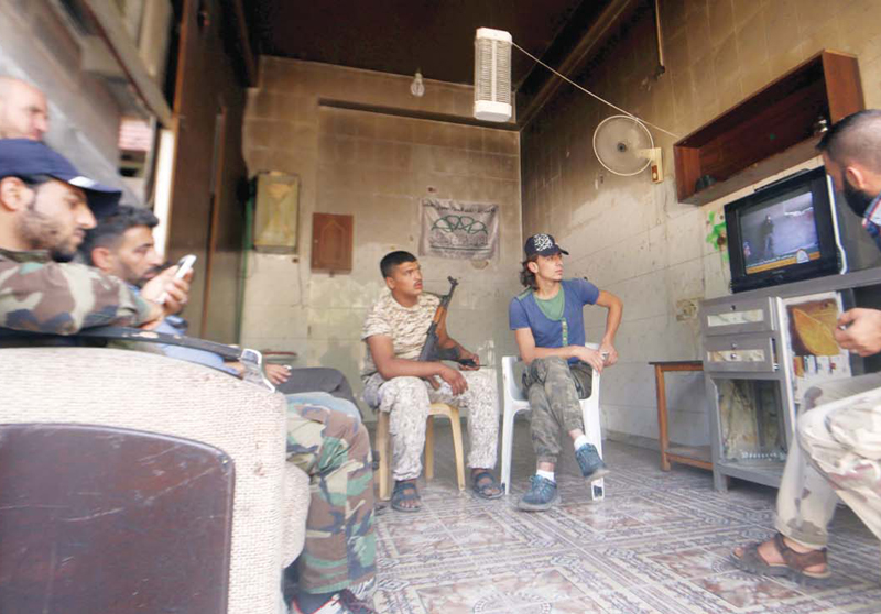 Tea breaks, video games: Syria rebels use truce to unwind