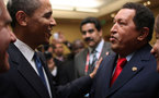 After handshake, Chavez offers Obama a book