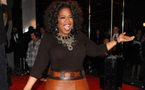 Oprah says she saw herself in dark film 'Precious'