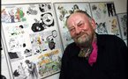 Danish cartoonist defiant despite threats