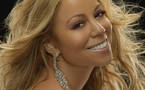 Mariah Carey pregnant, says first child due in spring