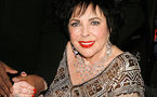 Liz Taylor 'greatly improved' after heart scare