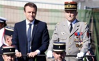 An embrace and clasped hands as Macron and Merkel mark WWI end