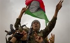 Rebels seize key Libyan town, Obama praises mission