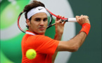 Federer battles past qualifier Evans to reach Open third round
