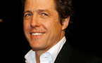 Hugh Grant becomes a dad, but mother's a mystery