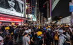 Hong Kong strike devolves into violence after protester is shot