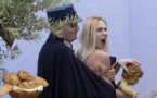 Topless Femen activist grabs Baby Jesus in St Peter's Square