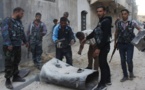 Barrel bombs kill 11 civilians in IS town in Syria