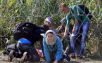 'Wake up call' as thousands of migrants pour into Austria