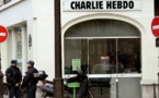 Charlie Hebdo marks anniversary edition with gun-wielding God