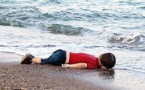 Drowned Syrian toddler's father wept over French cartoon