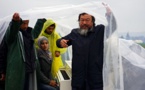 Ai Weiwei brings white grand piano to muddy refugee field